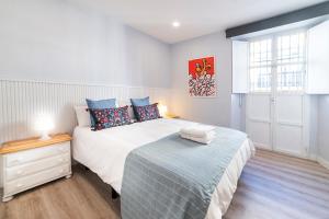 Postel nebo postele na pokoji v ubytování Apartamentos Alfaqueque A