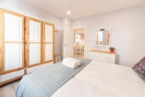 Postel nebo postele na pokoji v ubytování Apartamentos Alfaqueque A