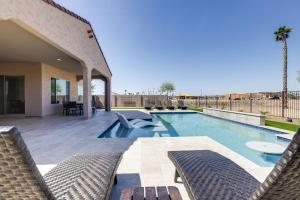 a swimming pool in the middle of a house at Goodyear Vacation Rental with Private Pool and Grill! in Goodyear