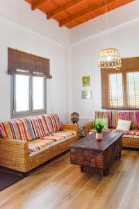 a living room with couches and a coffee table at Galatia's House in Kouklia