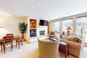 a living room with a couch and a table at The Village Glen in Vail