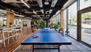a ping pong table in the middle of a room at For Students Only The Oaks in Coventry in Coventry