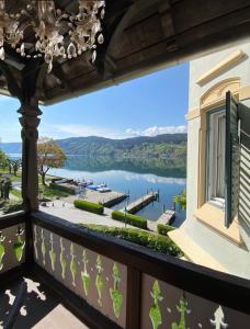 a balcony with a view of a lake at Villa Streintz in Millstatt