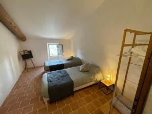 Postel nebo postele na pokoji v ubytování La Bastide