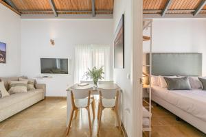 a living room with a table and a couch at ISG Apartments Zaragoza-FREE PARKING in Seville
