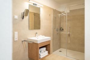 Koupelna v ubytování Wildbach Lodge Dienten + 20 fotografií