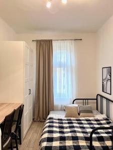 a bedroom with a bed and a window at Quiet apartment close to center in Prague