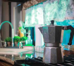 a coffee pot sitting on top of a kitchen counter at Brisas de Isabela Cozy Glamper 1 in Isabela