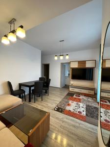 a living room with a couch and a table at 97 RENT House in Bucharest