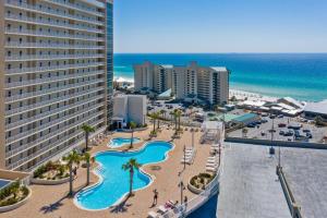 an aerial view of a resort with a pool and beach at Laketown Wharf #824 by Nautical Properties in Panama City Beach