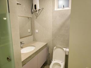 a small bathroom with a toilet and a sink at Arora View in Maafushi