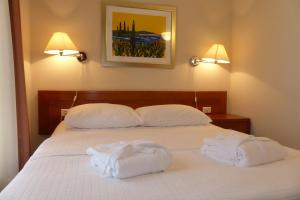 Posteľ alebo postele v izbe v ubytovaní Apartments Punta