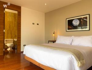 Un ou plusieurs lits dans un hébergement de l'établissement Luxury Penthouse Triplex with Oceanview and Jacuzzi