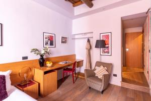 a hotel room with a desk and a chair at DownTown Boutique House in Rome