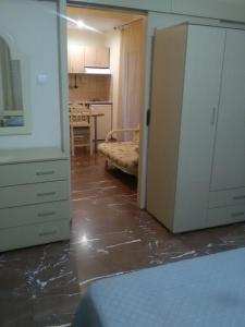 A bed or beds in a room at Alexandros Studios & Apartments