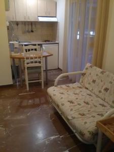 A kitchen or kitchenette at Alexandros Studios & Apartments