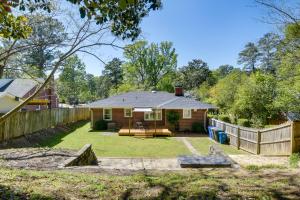 a backyard with a fence and a house at Fayetteville Vacation Rental - 1 Mi to Downtown! in Fayetteville