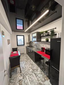 A kitchen or kitchenette at Perla Home
