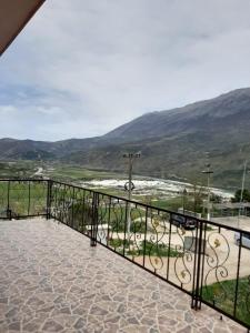 a balcony with a view of a mountain at Guesthouse Lula in Tepelenë