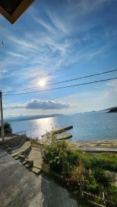 a view of the ocean from a house at Gianni's Apartment By The Sea in Ammouliani