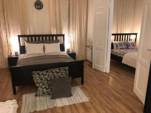 Кровать или кровати в номере Dohány Central Apartment