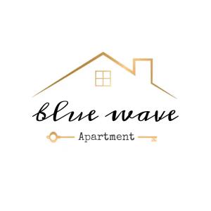 um sinal para apartamento de ondas azuis com uma casa em Blue Wave Apartment em Bari