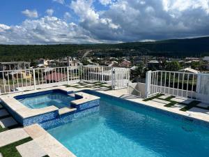 a swimming pool on top of a building at Luxury 1 Bedroom & Rooftop Pool unit #2 in Falmouth