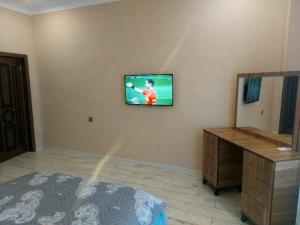 TV a/nebo společenská místnost v ubytování SUNRISE Guest House