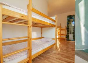 a bedroom with two bunk beds in a room at Vibe Hostel Sopot in Sopot