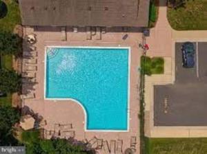 an overhead view of a swimming pool in a house at Rehoboth Crossing - Beach Oasis! in Rehoboth Beach