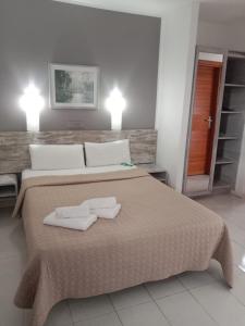 a bedroom with a bed with two towels on it at La Casita di Fuerte in Caleta De Fuste +71 photos