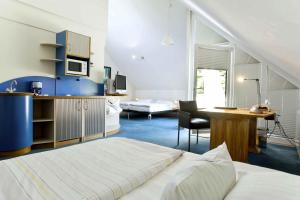 Kuchyň nebo kuchyňský kout v ubytování Hotel Watthalden