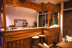 a bar in a restaurant with stools at Golhaaviewinn in Thulusdhoo