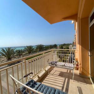 a balcony with a view of the ocean at شقة باطلاله بحريه - أبراج الشاطئ البيلسان Seafront Apartment in King Abdullah Economic City