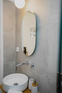 a bathroom with a sink and a mirror at MYKONOS HOUSE Vitality , Mykonos town in Mikonos