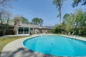 a swimming pool in front of a house at Wilmington Rental about 4 Mi to Wrightsville Beach! in Wilmington