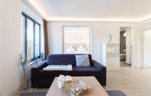 a living room with a couch and a table at Princess in Binz +39 photos