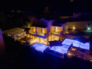 an aerial view of a house at night at Dimani Suites in Gythio