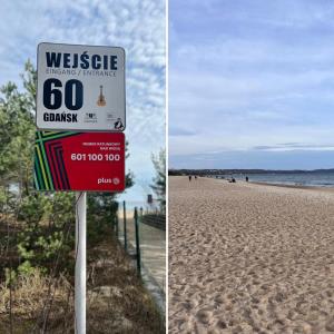 a sign on a beach with a speed limit at Apartament Piastowska in Gdańsk