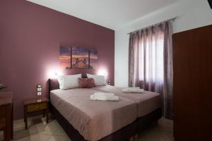 A bed or beds in a room at Mari Helen
