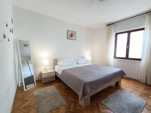Posteľ alebo postele v izbe v ubytovaní Apartments Devic
