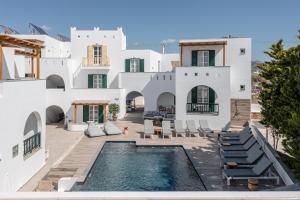 a villa with a swimming pool and a house at Spiros in Naxos Chora