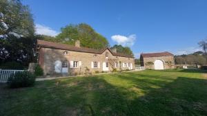 an old brick house with a large yard at Les Jardins de Bathilde - Au sein du Château de Bothané in Guidel