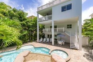 an exterior view of a house with a swimming pool at Sea Spray in Siesta Key