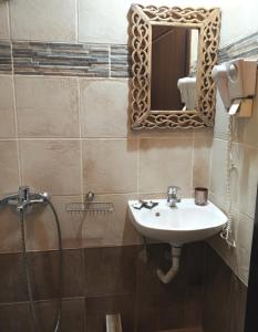 Kylpyhuone majoituspaikassa Athina-Milina
