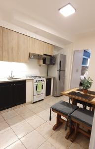 A kitchen or kitchenette at Av Avellaneda - Bon Repos