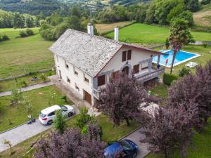 an aerial view of a house with a pool at Caserío Félix in Baralla