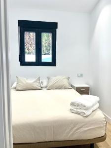 Postel nebo postele na pokoji v ubytování Villa Toñi + 13 fotografií