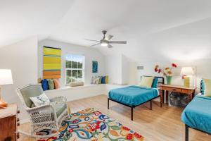 a living room with a couch and a chair at Redbird Retreat On Lake Travis in Marble Falls