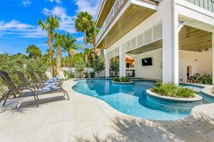 a swimming pool in the backyard of a house at Ocean Overlook in Siesta Key